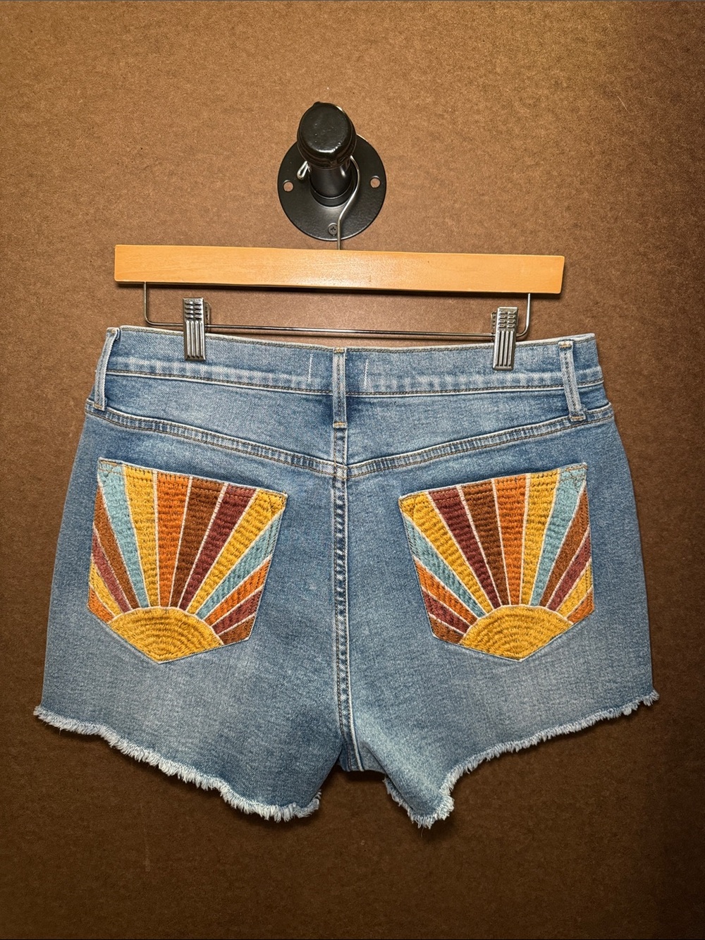 Women's Light Blue Denim Shorts with Embroidered Sunburst Pockets